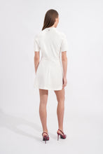 Load image into Gallery viewer, Woman wearing a white dress on a plain background