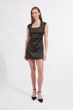 Load image into Gallery viewer, Elevate your evening wardrobe with our Dark Moss Satin Mini Dress. This piece stands out with its unique "bog green" undertone—a sophisticated, deep earthy shade that exudes "quiet luxury." The structured square neckline and high-quality satin finish make it a timeless choice for any high-end occasion.