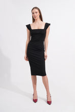 Load image into Gallery viewer, Woman wearing a black dress with cap sleeves on a white background