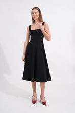 Load image into Gallery viewer, Woman wearing a black dress on a white background