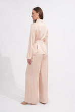 Load image into Gallery viewer, Woman wearing a beige suit on a white background