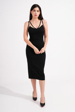 Load image into Gallery viewer, Woman wearing a black dress against a white background