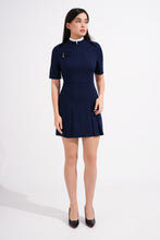 Load image into Gallery viewer, Woman wearing a navy blue dress on a white background