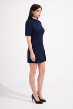Load image into Gallery viewer, Woman wearing a navy blue dress on a white background
