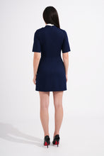 Load image into Gallery viewer, Woman wearing a navy blue dress on a white background