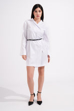 Load image into Gallery viewer, Woman wearing a white dress with a black belt on a white background