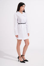 Load image into Gallery viewer, Woman wearing a white dress with a black belt on a white background