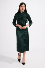 Load image into Gallery viewer, Woman wearing a green dress with a white background