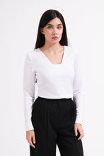 Load image into Gallery viewer, Woman wearing a white long-sleeve top and black pants on a white background