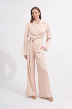 Load image into Gallery viewer, Woman wearing a light beige outfit on a white background
