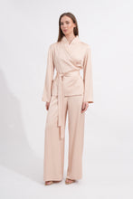 Load image into Gallery viewer, Woman wearing a light beige outfit on a white background
