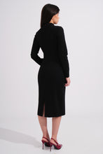 Load image into Gallery viewer, Woman wearing a black dress with a high slit on a white background
