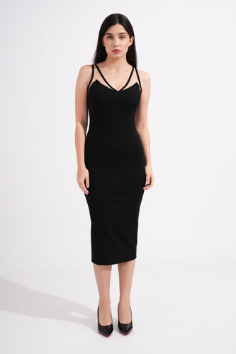 Woman wearing a black dress against a white background