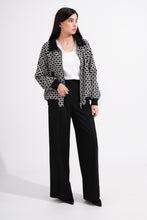 Load image into Gallery viewer, Woman wearing a patterned jacket, white shirt, and black pants on a white background

