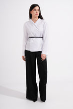 Load image into Gallery viewer, Woman wearing a white blouse and black pants on a white background
