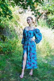 A colorful summer dress featuring maxi length, high front slit, and kimono style. - v-neckline&nbsp; - long puffy sleeves - fabric belt with tassels - shift silhouette - kimono style - maxi length
