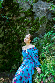 A colorful summer dress featuring maxi length, high front slit, and kimono style. - v-neckline&nbsp; - long puffy sleeves - fabric belt with tassels - shift silhouette - kimono style - maxi length