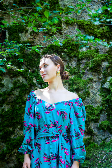 A colorful summer dress featuring maxi length, high front slit, and kimono style. - v-neckline&nbsp; - long puffy sleeves - fabric belt with tassels - shift silhouette - kimono style - maxi length