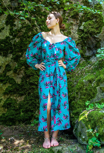 A colorful summer dress featuring maxi length, high front slit, and kimono style. - v-neckline&nbsp; - long puffy sleeves - fabric belt with tassels - shift silhouette - kimono style - maxi length