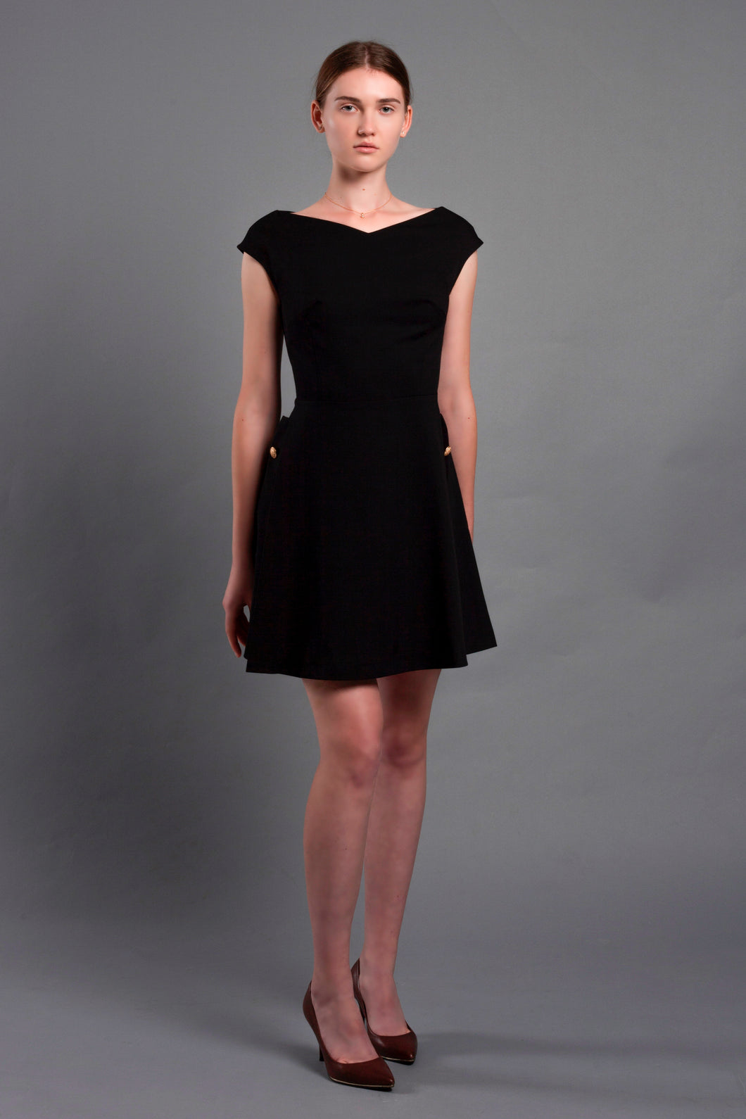 Black mini dress with pleated skirt